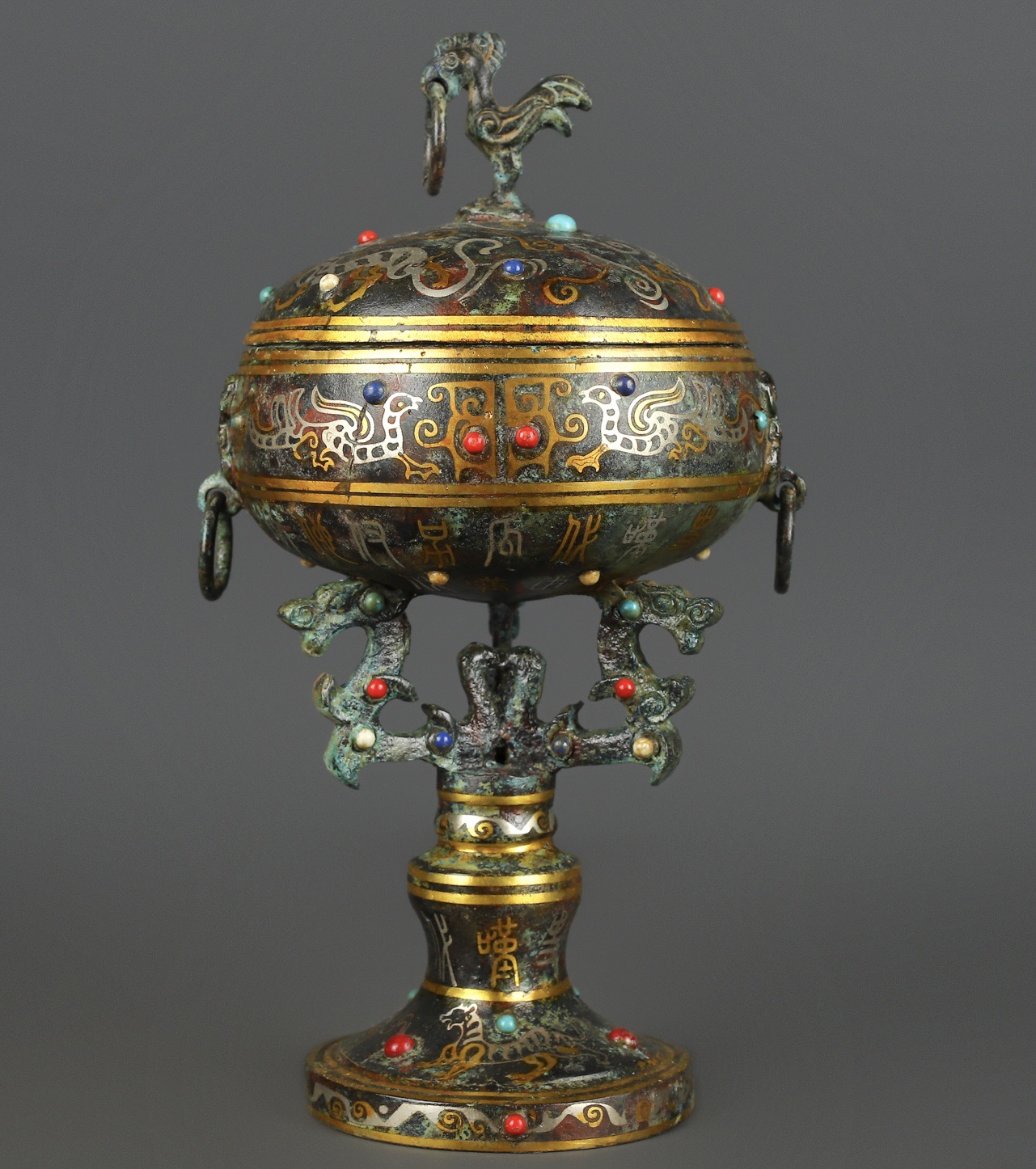 Han Dynasty Bronze and gold inlaid standing bird bean