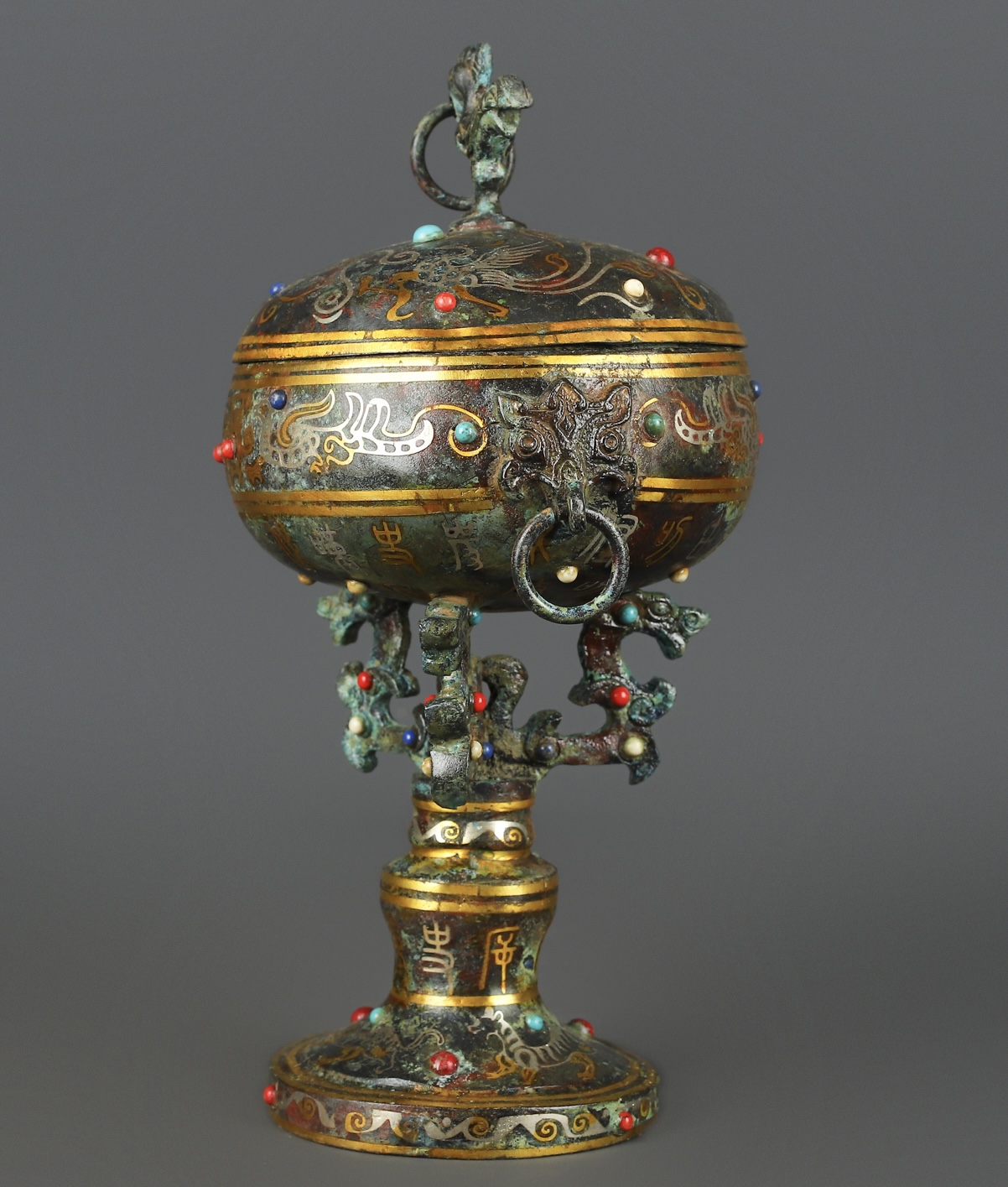 Han Dynasty Bronze and gold inlaid standing bird bean