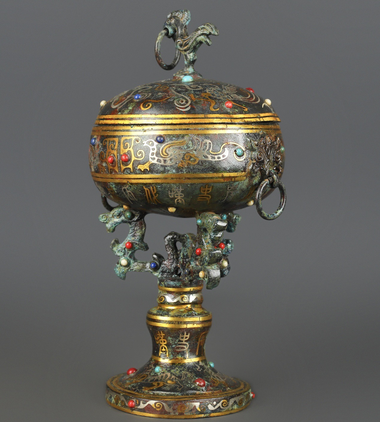 Han Dynasty Bronze and gold inlaid standing bird bean