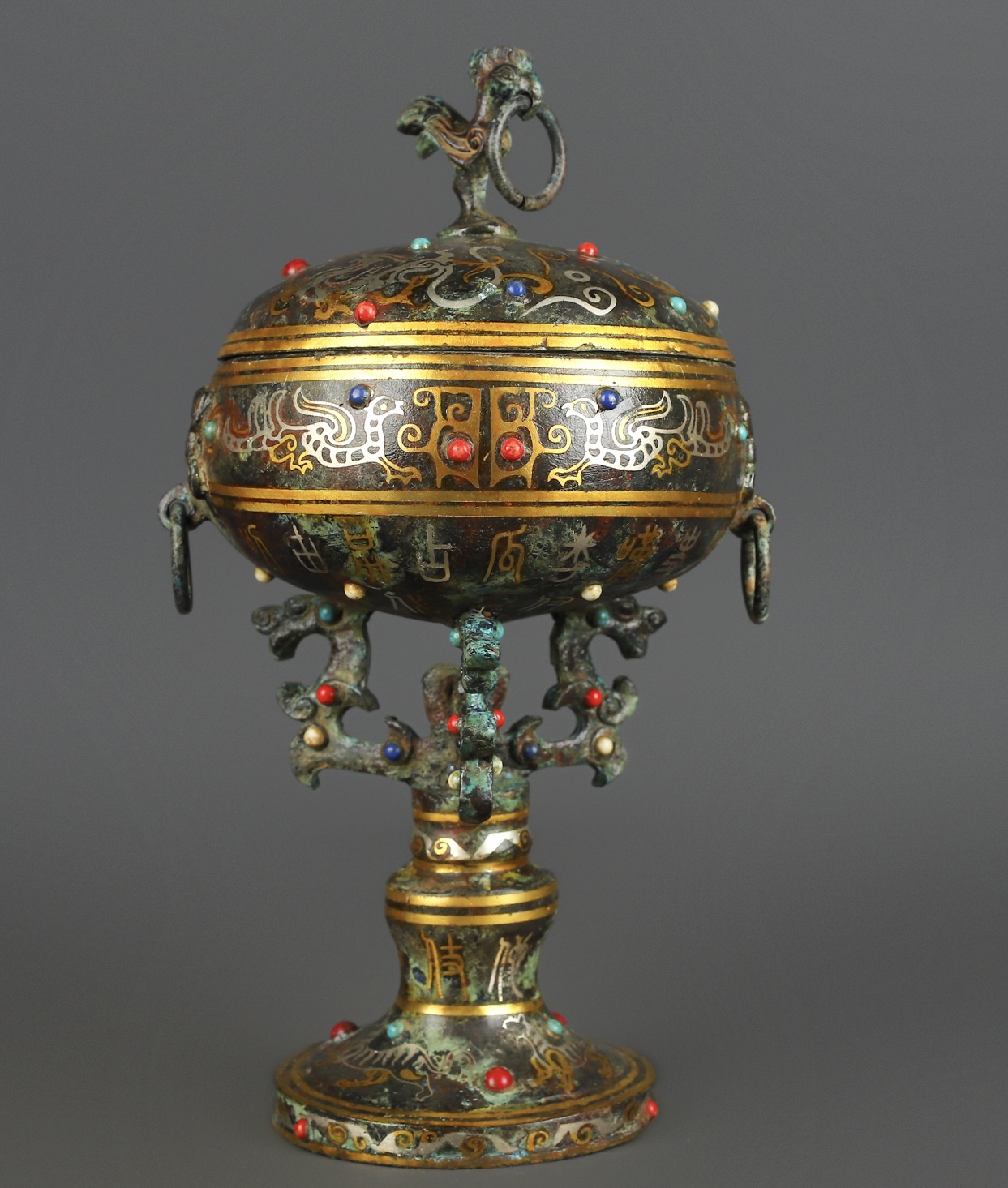 Han Dynasty Bronze and gold inlaid standing bird bean