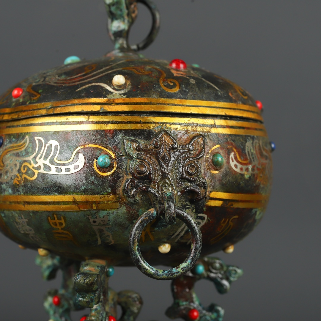 Han Dynasty Bronze and gold inlaid standing bird bean