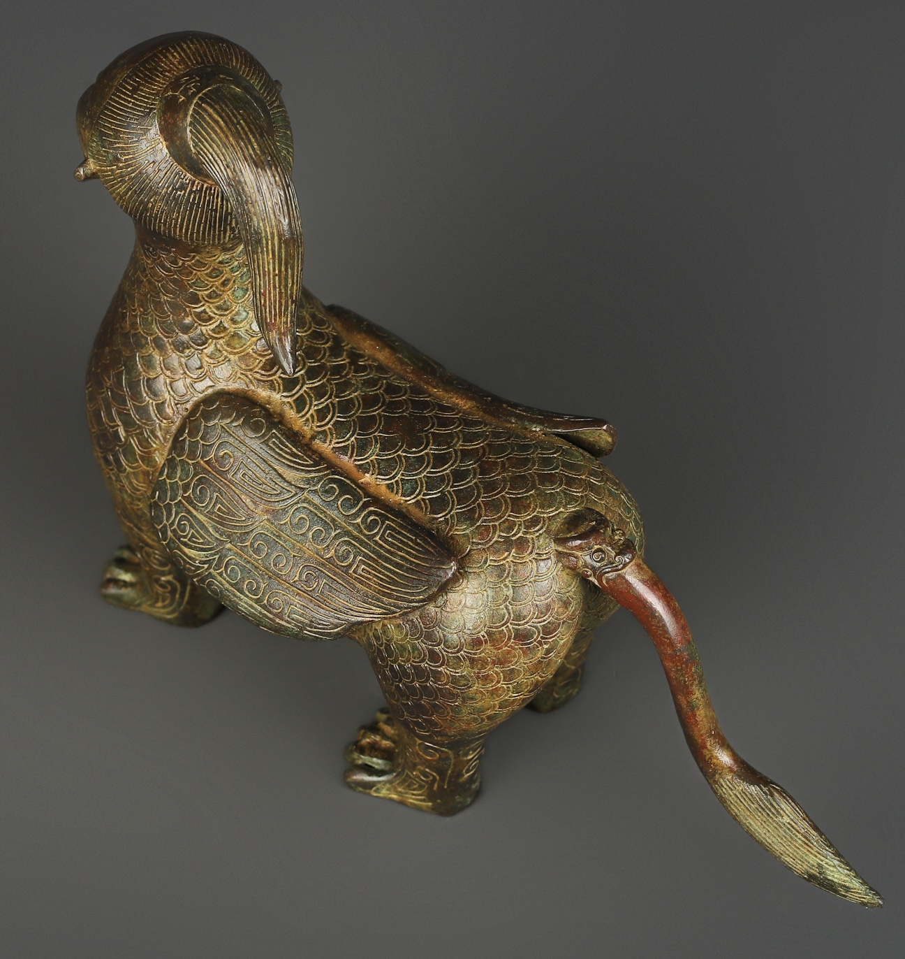 Zhou Dynasty Bronze human faced long tailed beast