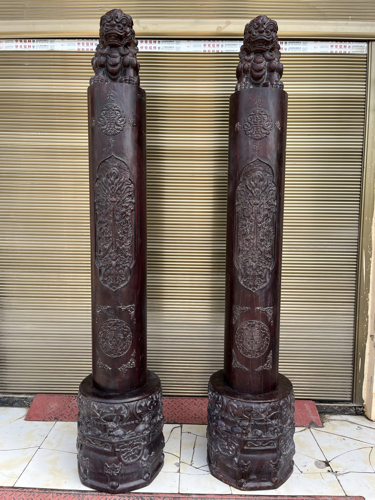 Qing Dynasty Sandalwood pair hand-carved lion head pillars