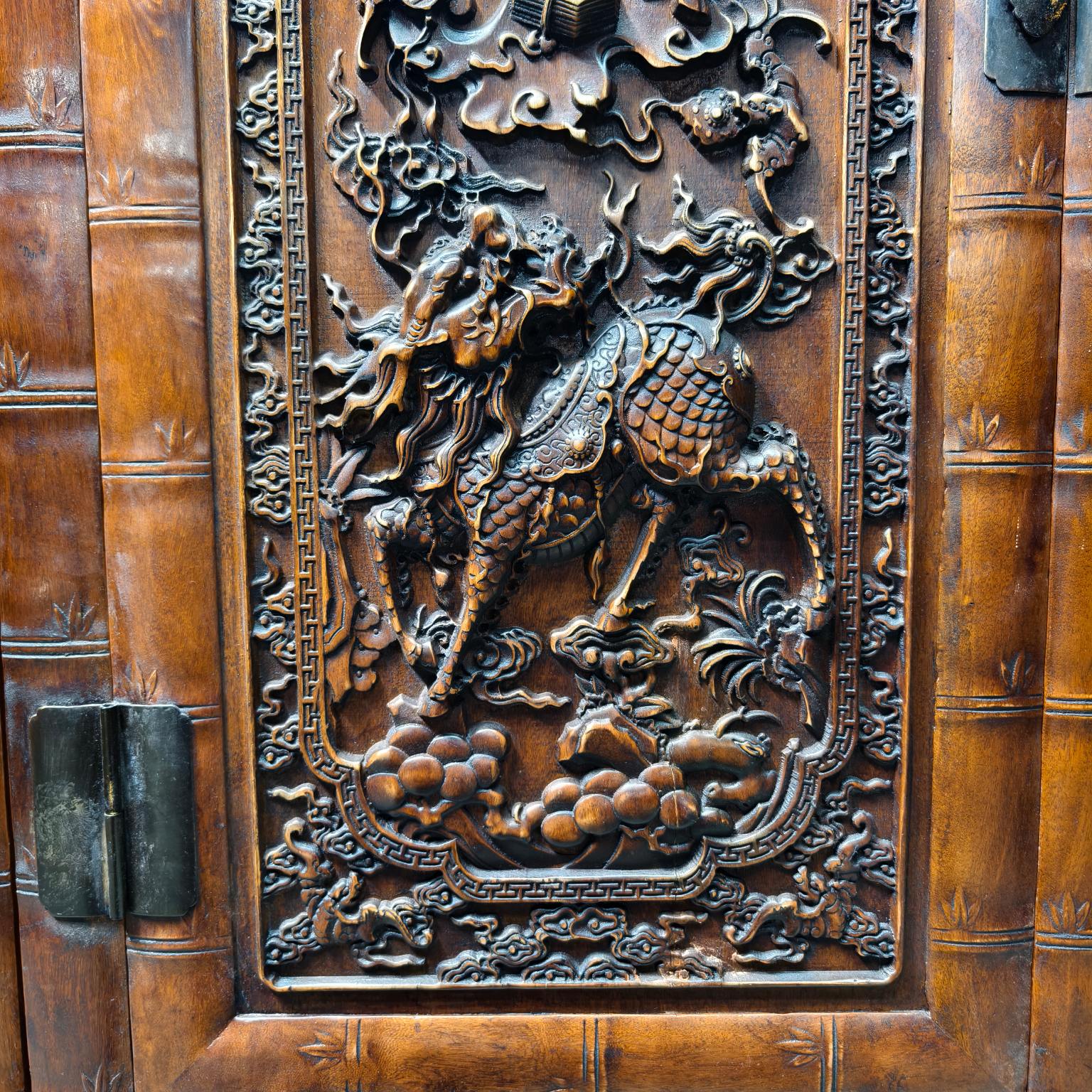 Qing Dynasty Rosewood high-relief cloud and unicorn pattern cabinet